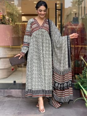 Gown- Cotton 60-60 Suit Cum Gown Set which is beautifully decorated with mirror lace detailing in neck. It is paired with matching dupatta and pant.